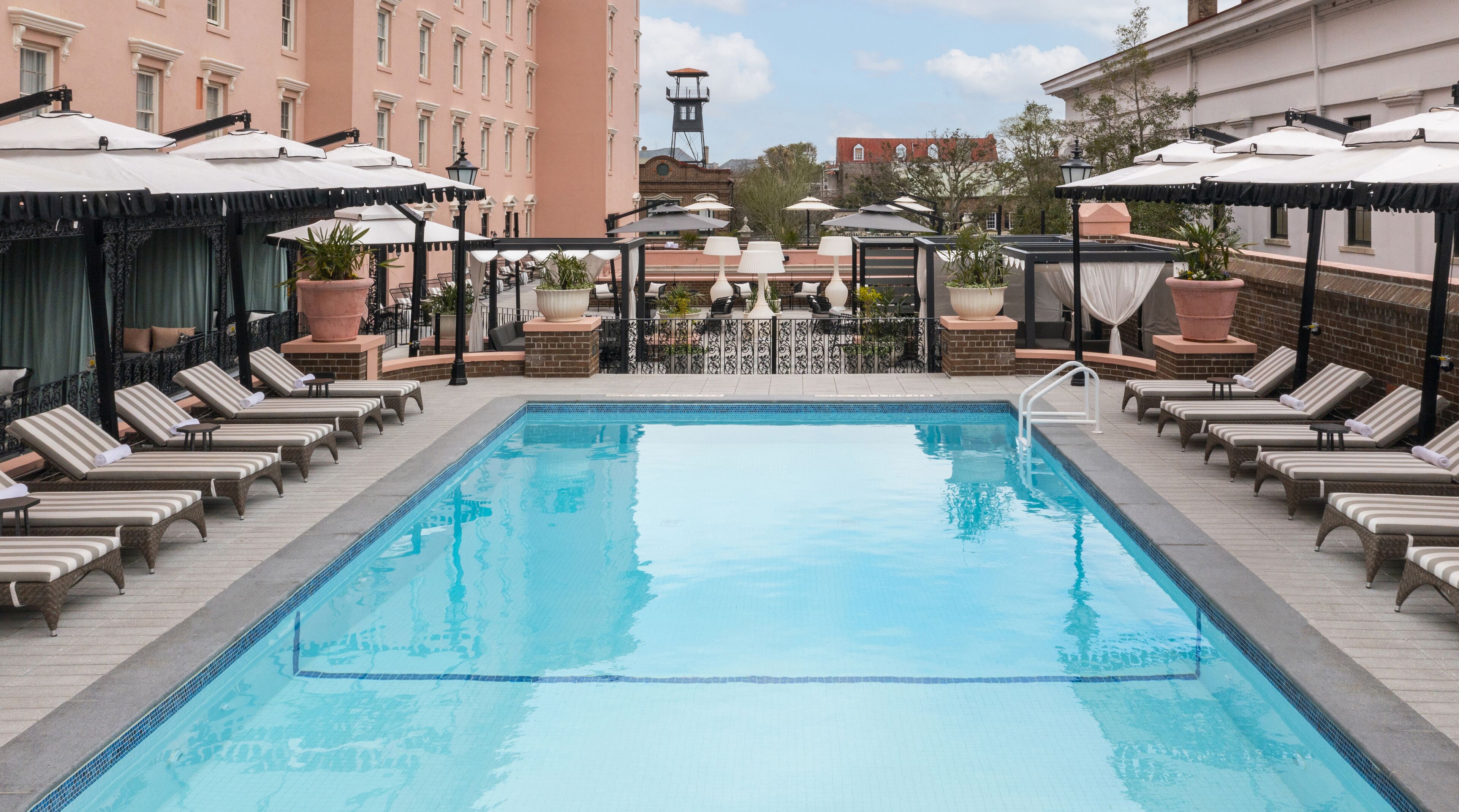 outdoor pool, open 8:00 am to 8:00 pm, pool loungers