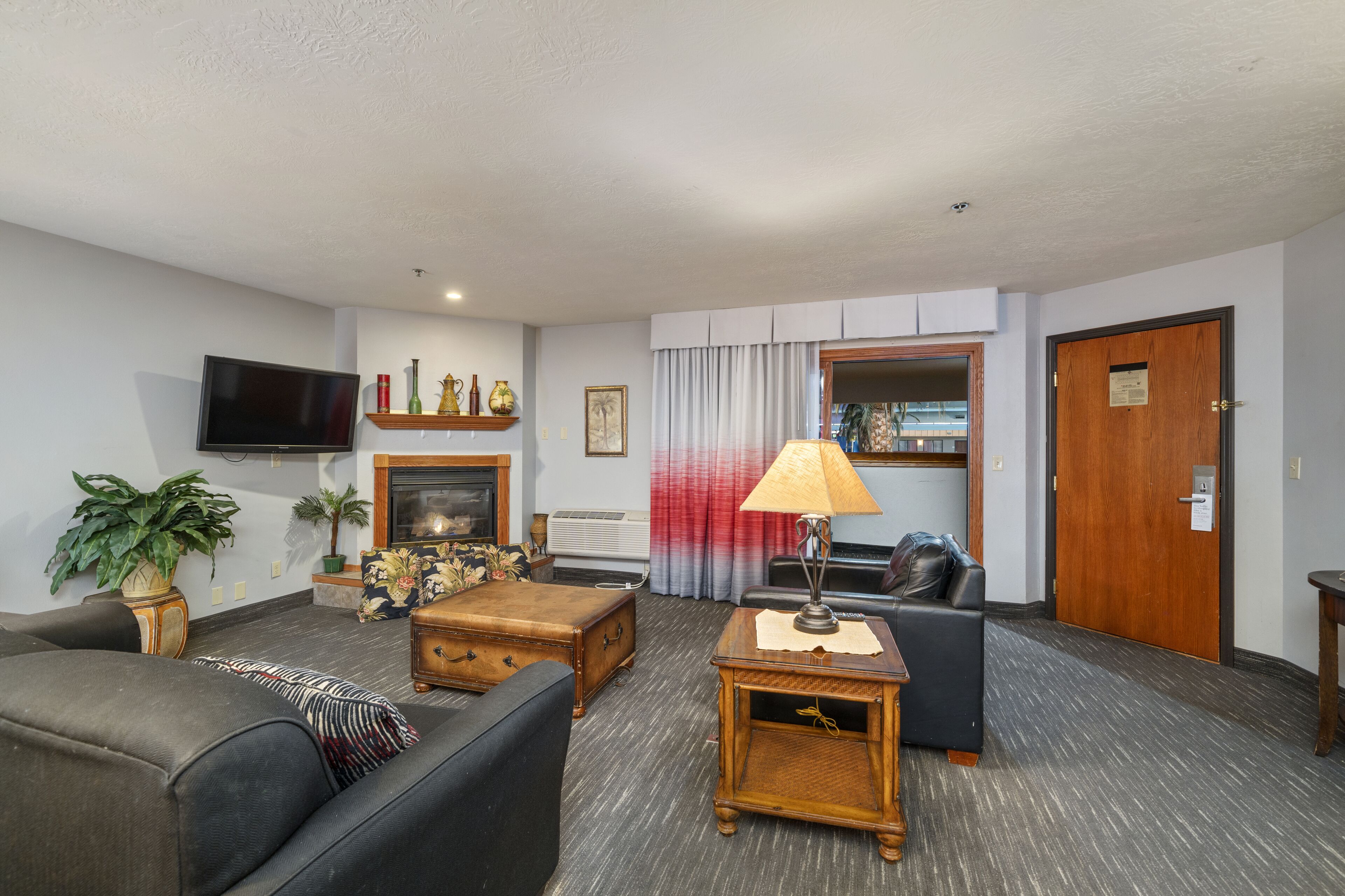 suite, 2 bedrooms, non smoking (1 king bed and 2 queen beds) | living area | lcd tv