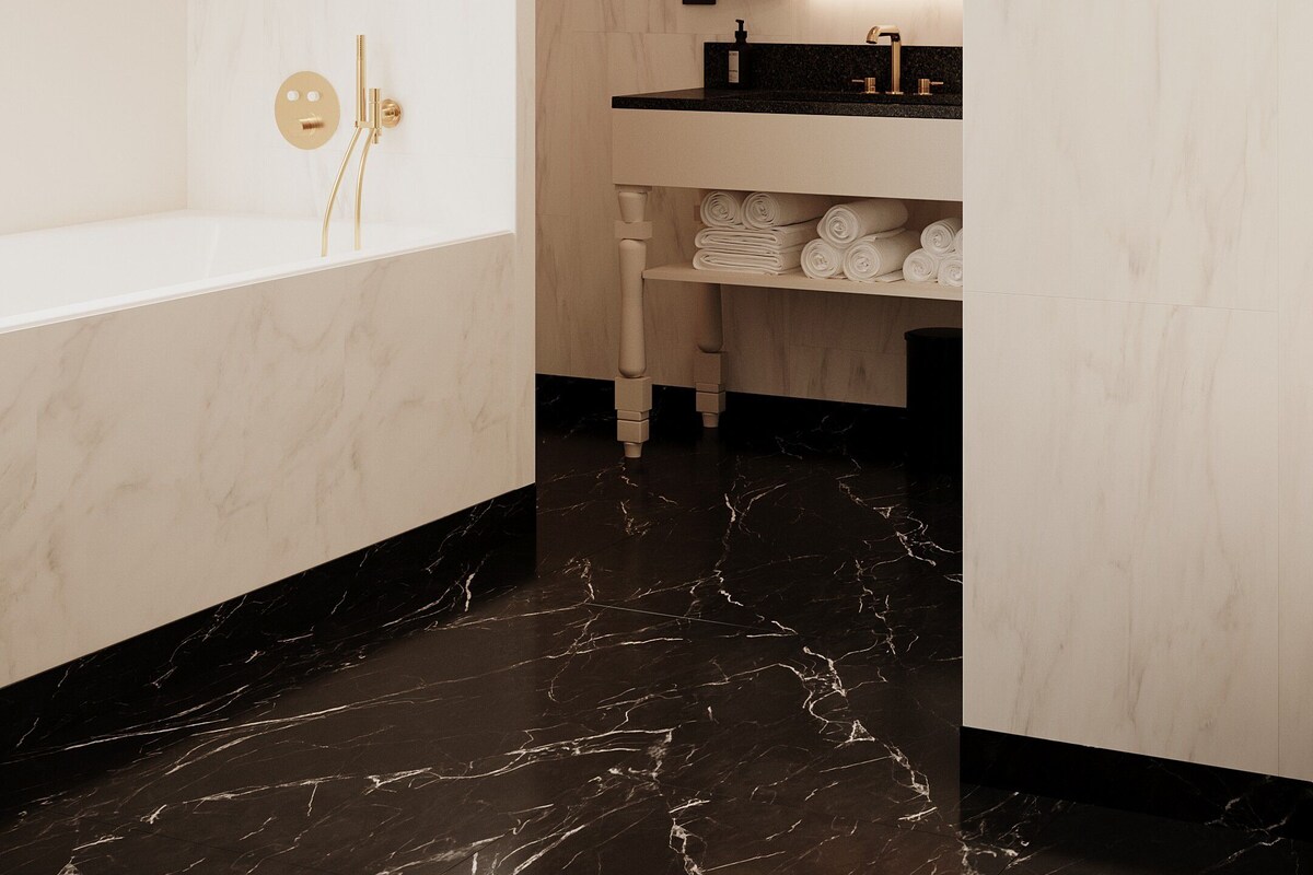 A modern bathroom with a freestanding bathtub, a vanity with a mirror, and a towel rack.
