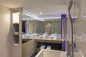 Suite | Bathroom | Rainfall showerhead, eco-friendly toiletries, hair dryer, towels