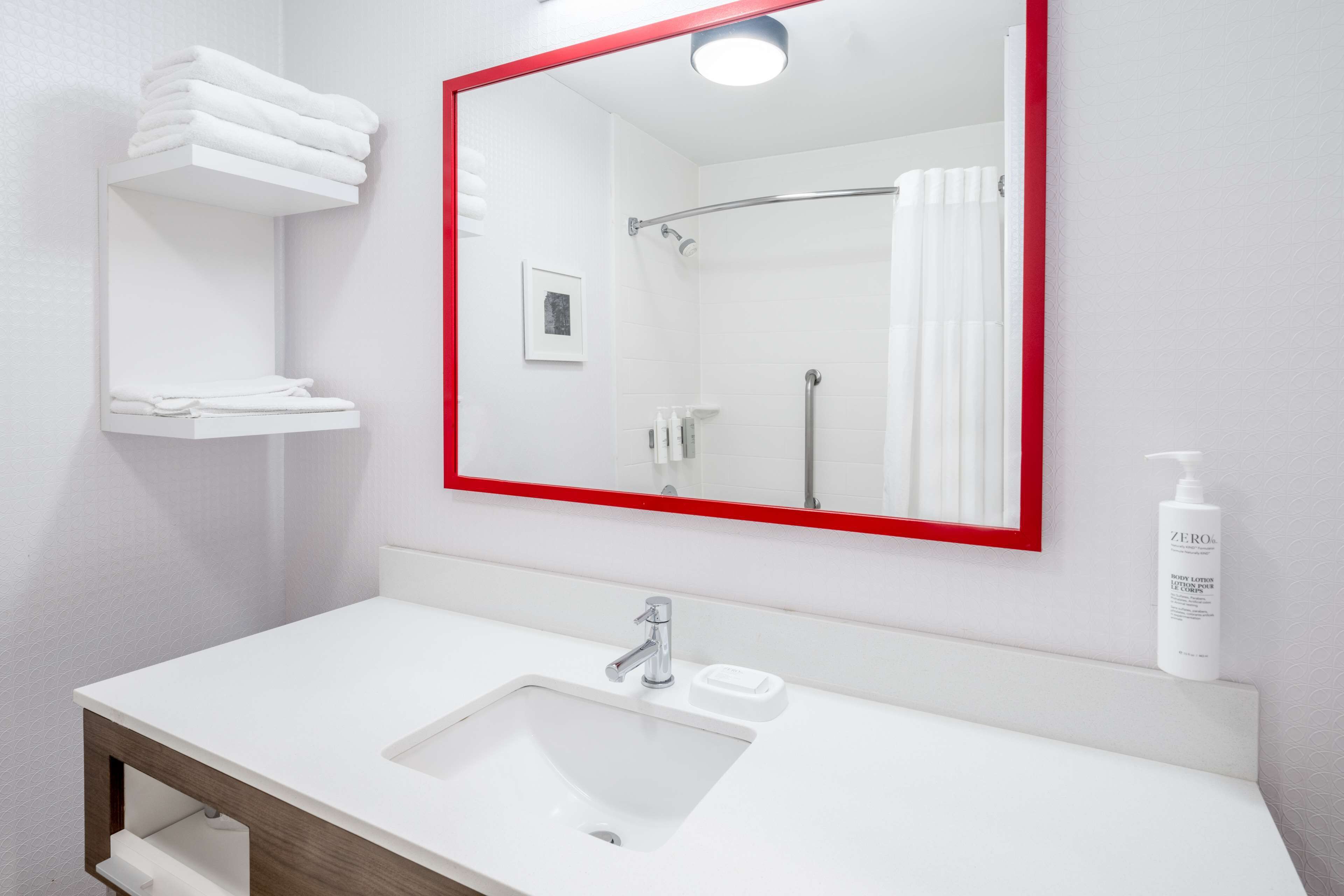 junior suite, 1 king bed, non smoking | bathroom | combined shower/bathtub, hair dryer, towels, soap