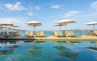 Outdoor pool, open 8:00 AM to 8:00 PM, sun loungers