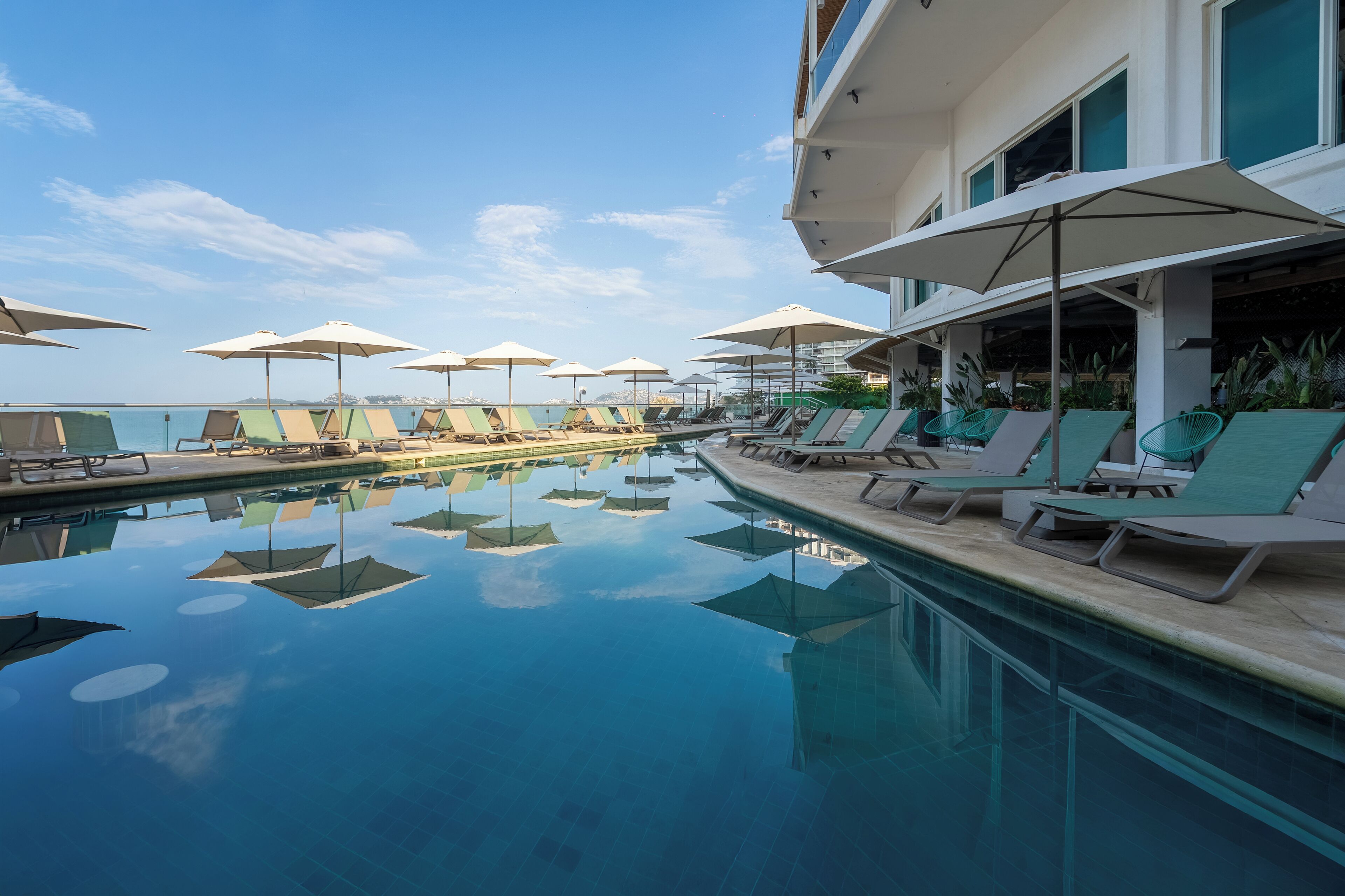 Outdoor pool, open 8:00 AM to 8:00 PM, sun loungers