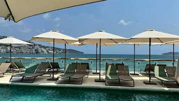 Outdoor pool, open 8:00 AM to 8:00 PM, sun loungers