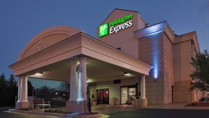 A Holiday Inn Express building with a covered entrance, columns, and a sign. - Holiday Inn Express Lynchburg by IHG (Lynchburg)