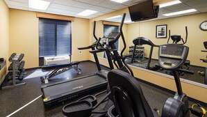 A gym with treadmills, elliptical machines, and weight benches. - Best Western Springfield West Inn (West Springfield)