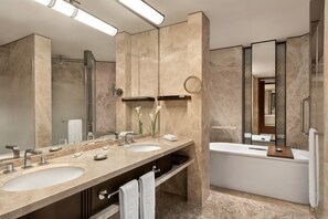 Separate bathtub and shower, free toiletries, hair dryer, bathrobes