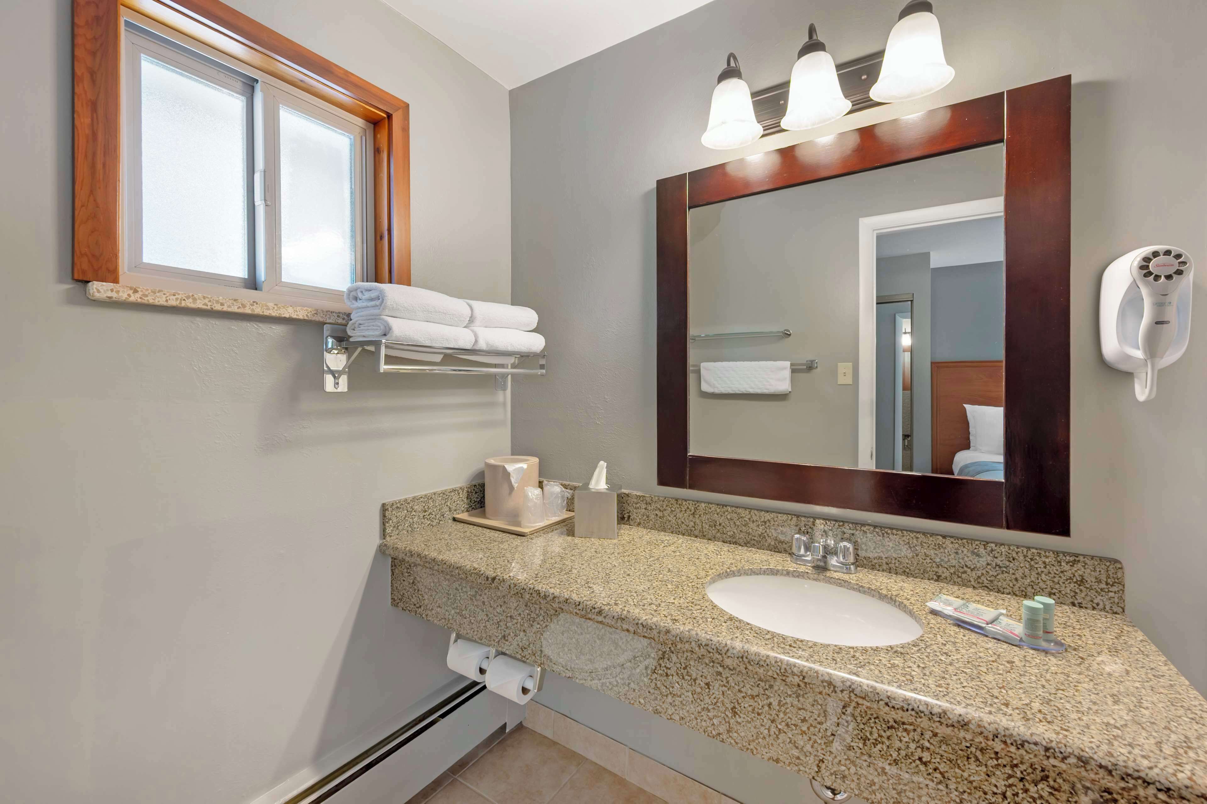 hair dryer, towels, toilet paper