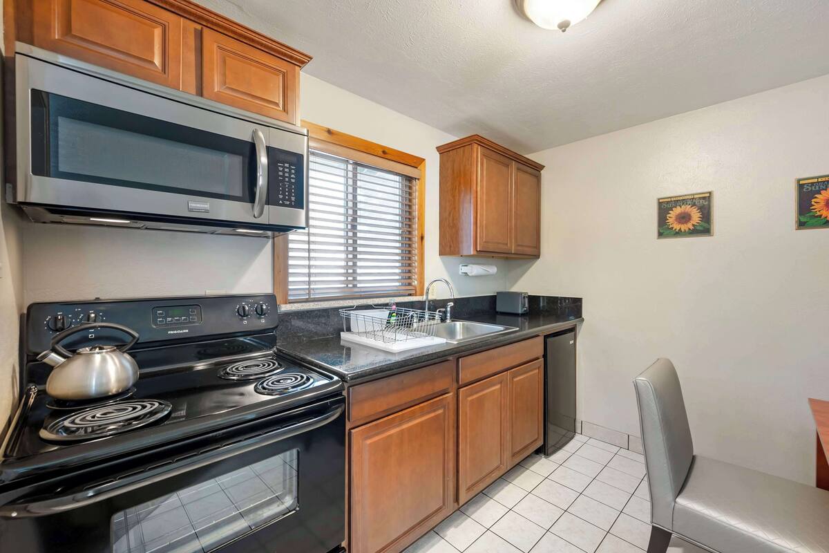 desk, blackout curtains, iron/ironing board, free cots/infant beds