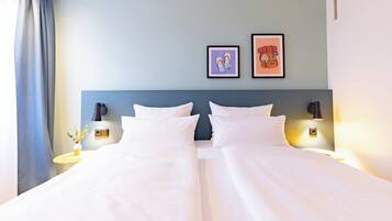 Hypo-allergenic bedding, down duvets, in-room safe, desk