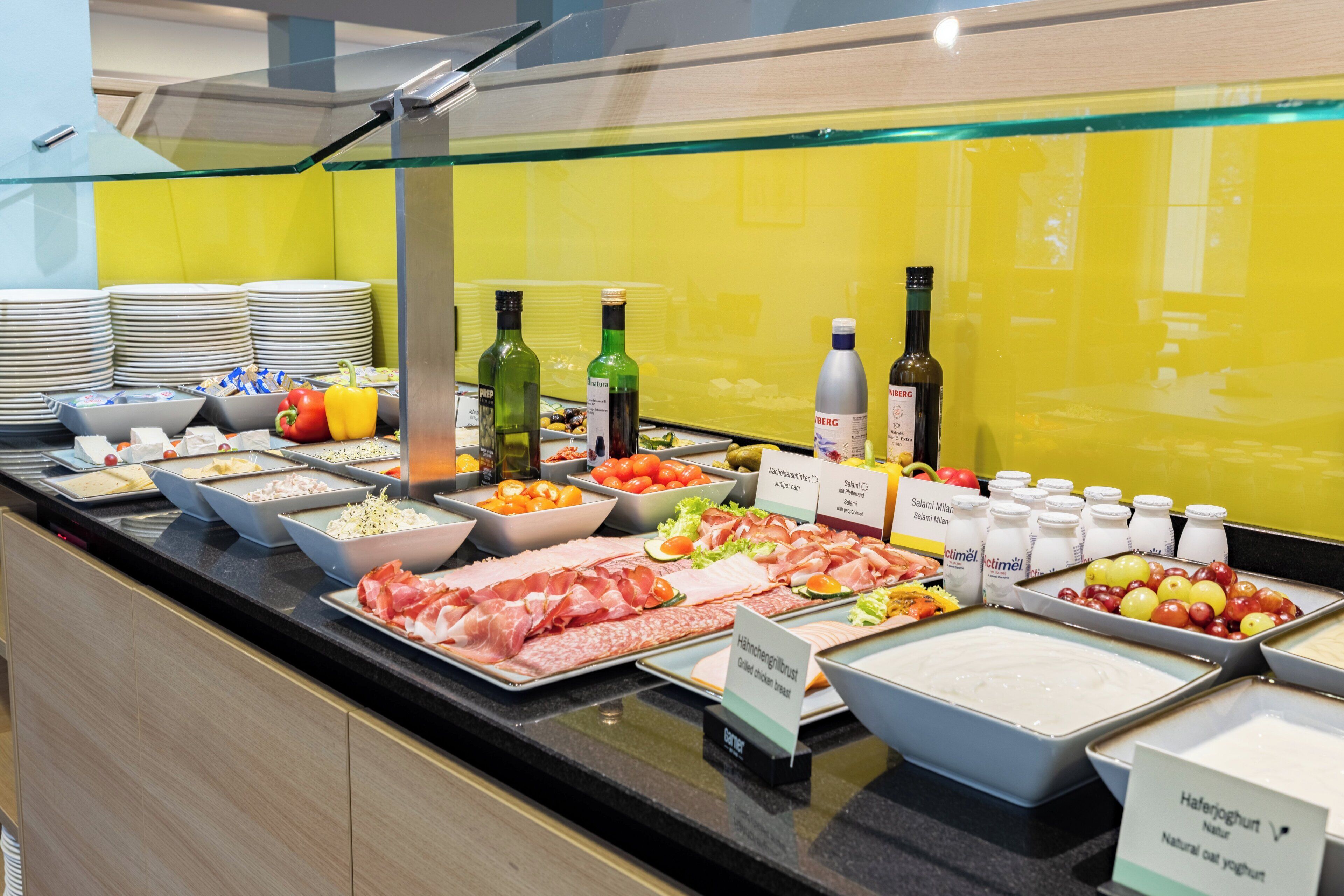 A buffet with various food items and beverages.