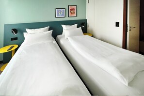 Hypo-allergenic bedding, down duvets, in-room safe, desk