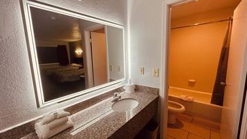 Deep-soaking bathtub, towels