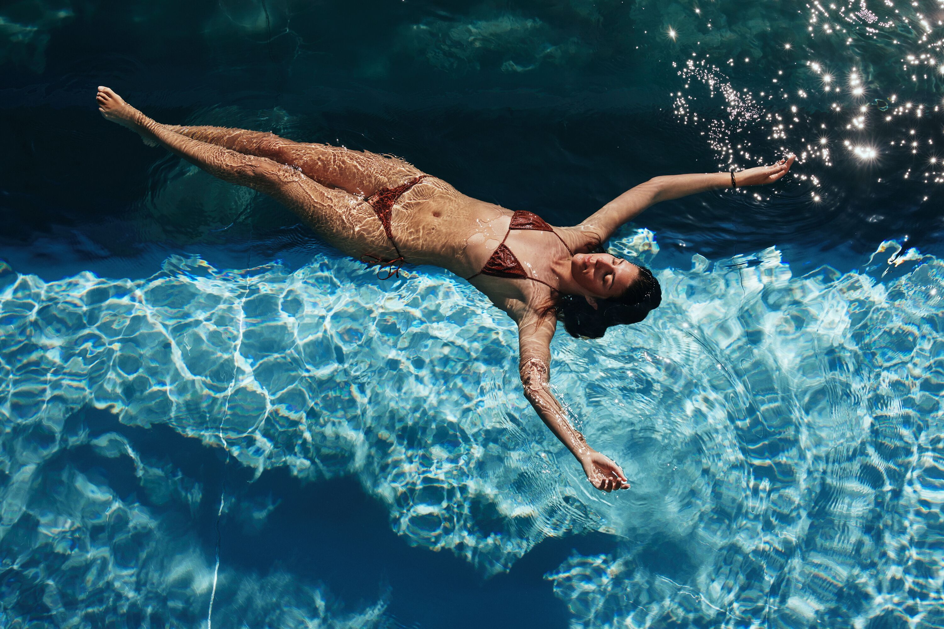 A person swimming in a pool.