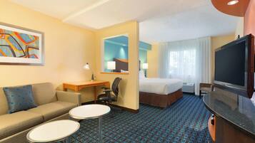 Premium bedding, desk, laptop workspace, blackout drapes