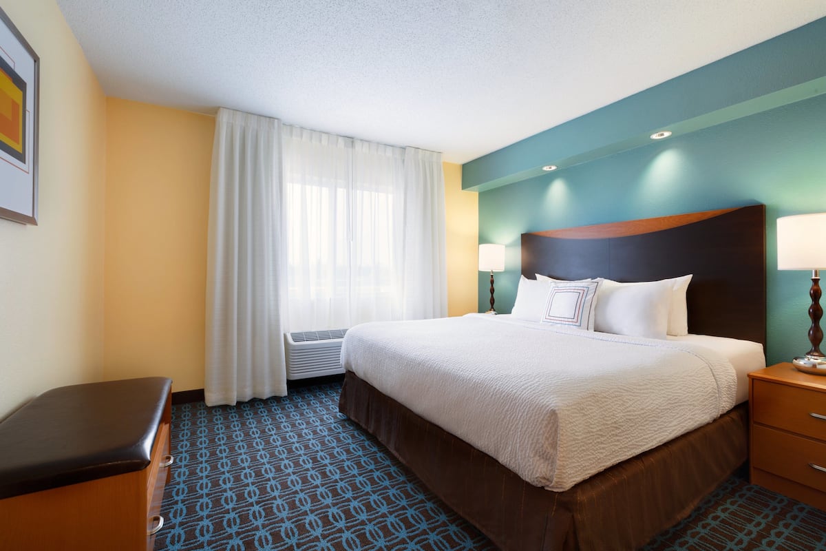 Premium bedding, desk, laptop workspace, blackout curtains