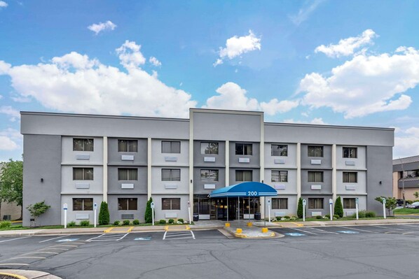 Welcome to Hotel 200, a modern hotel with a symmetrical facade and flat roofline.