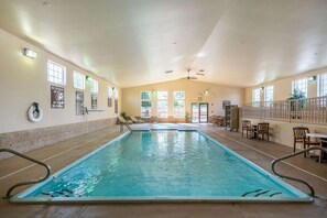 Indoor pool, open 8:00 AM to 10:00 PM, pool loungers