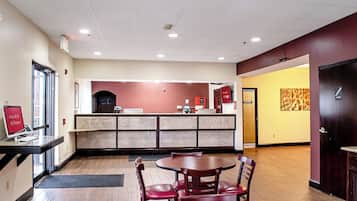 A restaurant with a counter, seating area, and a door marked 'ELECTRICAL'.