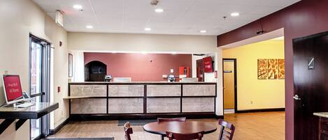 A restaurant with a counter, seating area, and a door marked 'ELECTRICAL'.