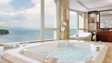 Combined shower/tub, designer toiletries, hair dryer, bathrobes