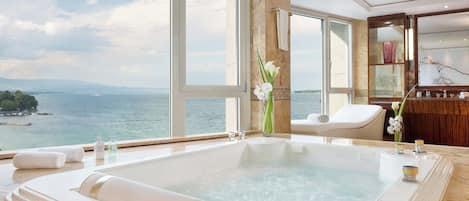 Combined shower/tub, designer toiletries, hair dryer, bathrobes