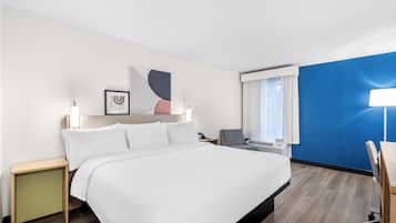 Desk, laptop workspace, blackout drapes, iron/ironing board