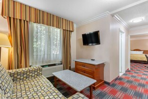 Desk, laptop workspace, blackout drapes, iron/ironing board