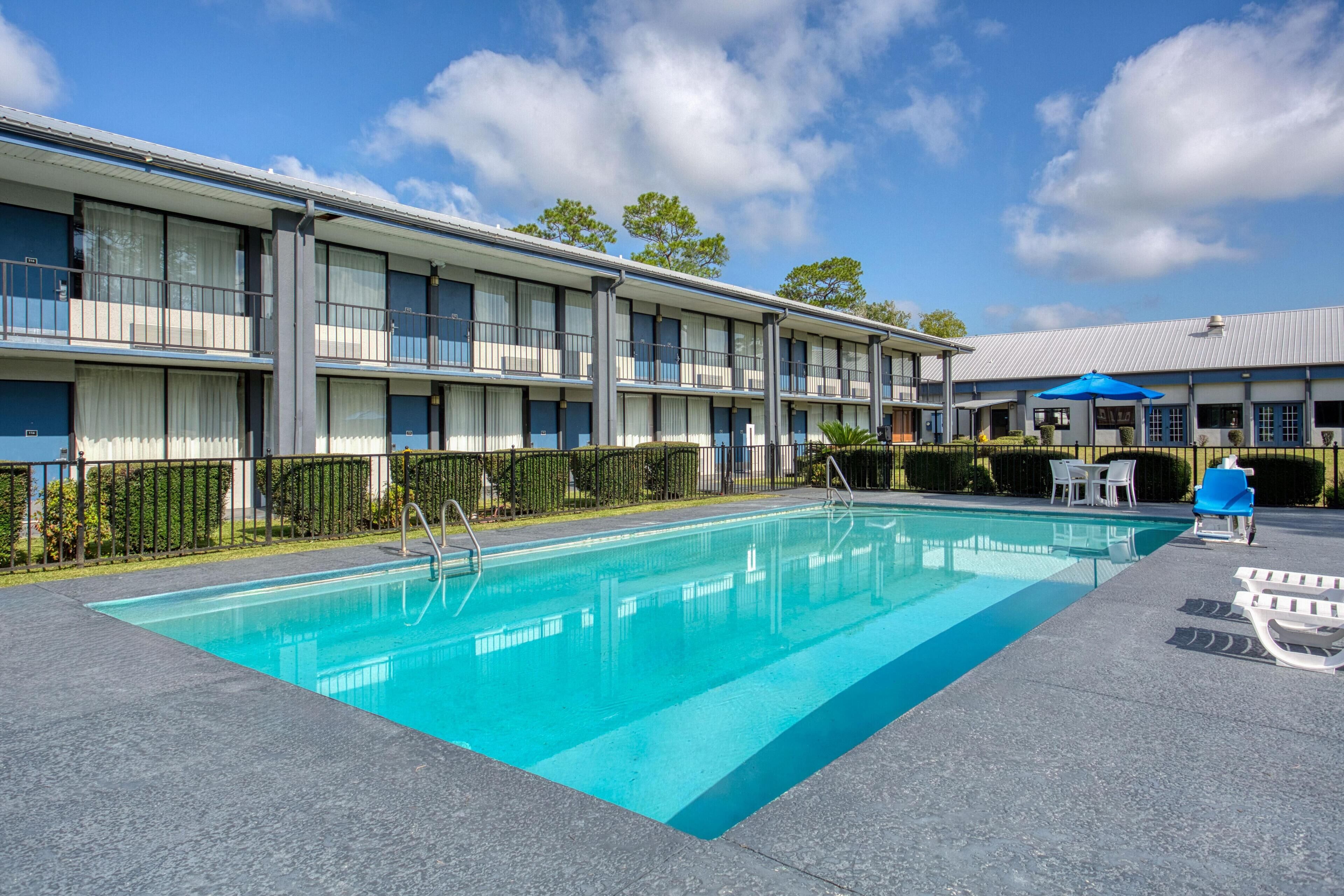 Seasonal outdoor pool, open 7:00 AM to 9:00 PM, pool umbrellas