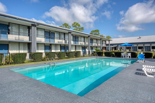 Seasonal outdoor pool, open 7:00 AM to 9:00 PM, pool umbrellas