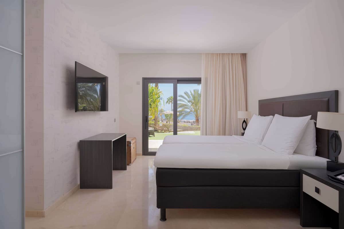 Junior Suite, Garden View | 2 bedrooms, premium bedding, minibar, in-room safe