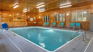 An indoor swimming pool with wooden walls, blue chairs, and a 'No Diving' sign. - Comfort Inn Near Kokomo Speedway (Kokomo)