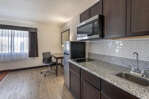 Standard Room, 1 King Bed, Non Smoking, Kitchen | In-room safe, desk, laptop workspace, iron/ironing board