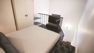 Un dormitorio con cama, armario, televisor y escalera.