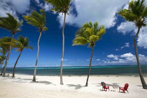 On the beach, white sand, beach towels - Sugar Beach Condo Resort (Christiansted)