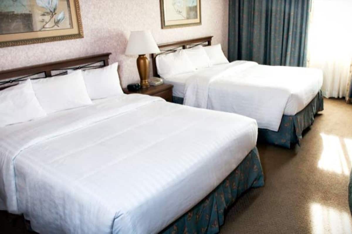Down comforters, desk, blackout drapes, iron/ironing board