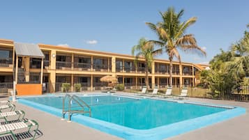 Outdoor pool, open 7 AM to 8 PM, pool umbrellas, pool loungers