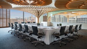 A conference room with a high ceiling, modern design, and a city view. - Sheraton Kansas City Hotel at Crown Center (Kansas City)
