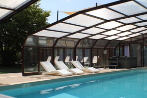 Indoor pool, open 8:00 AM to 9:00 AM, pool loungers