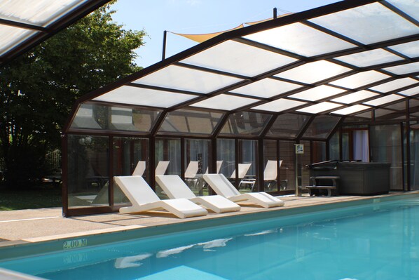 Indoor pool, open 8:00 AM to 9:00 AM, pool loungers