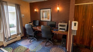 A hotel room with a desk, two chairs, a printer, and a window with curtains. - Holiday Inn Express Hotel & Suites Pittsburgh Airport by IHG (Pittsburgh)