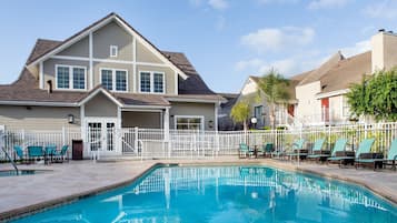 Outdoor pool, open 6:00 AM to 10:00 PM, pool loungers