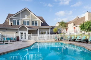 Outdoor pool, open 6:00 AM to 10:00 PM, pool loungers