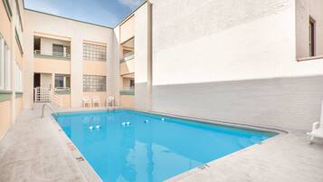 Seasonal outdoor pool, open 10:00 AM to 8:00 PM, sun loungers