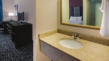 Premium bedding, desk, laptop workspace, blackout drapes