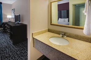 Premium bedding, desk, laptop workspace, blackout curtains