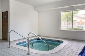 Indoor pool, open 7:00 AM to 11:00 PM, pool loungers