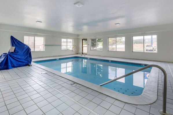 Indoor pool, open 7:00 AM to 11:00 PM, pool loungers
