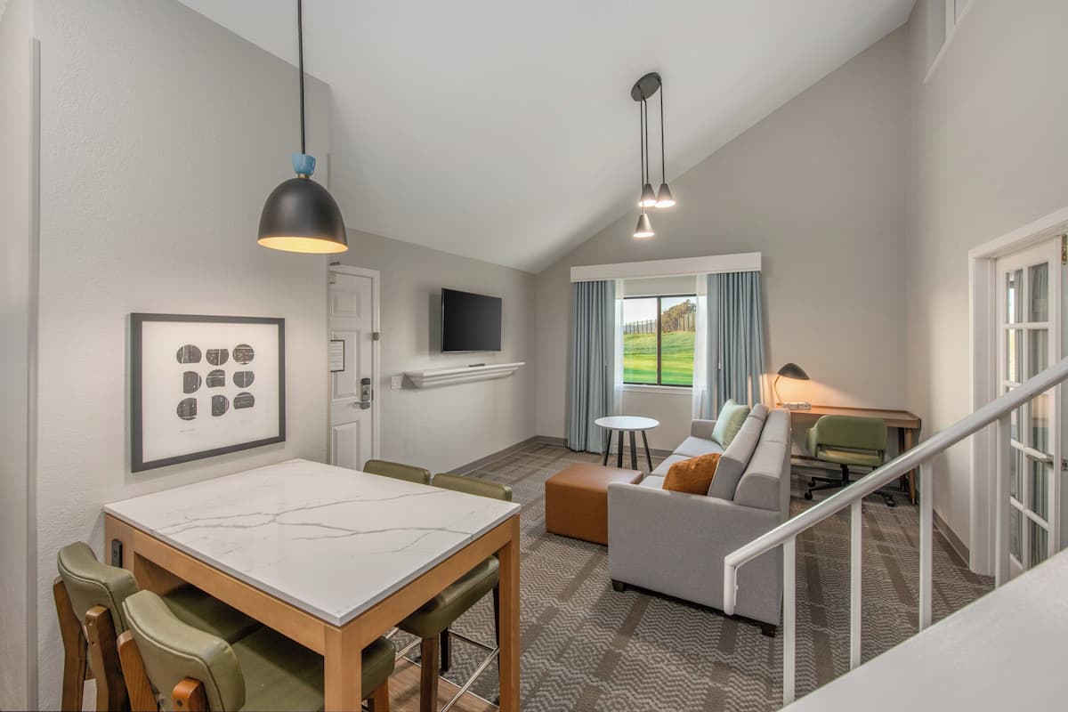 Loft, 2 Queen Beds, Kitchen, Golf View (Bi Level Suite) | Desk, laptop workspace, iron/ironing board, free cribs/infant beds