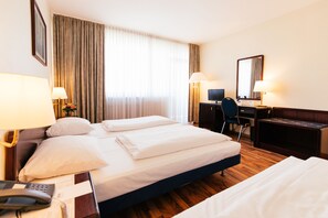 Triple Room | Minibar, in-room safe, desk, soundproofing